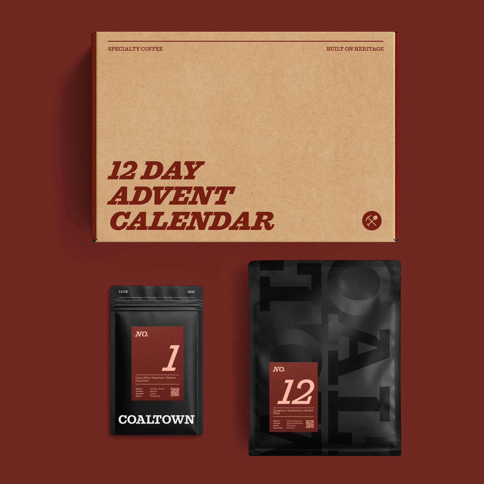 A 12-day Advent calendar coffee set by COALTOWN, featuring a large kraft card box labeled '12 DAY ADVENT CALENDAR' and 11 x 40g black coffee bags and 1 x 200g bag, arranged on a dark red background.