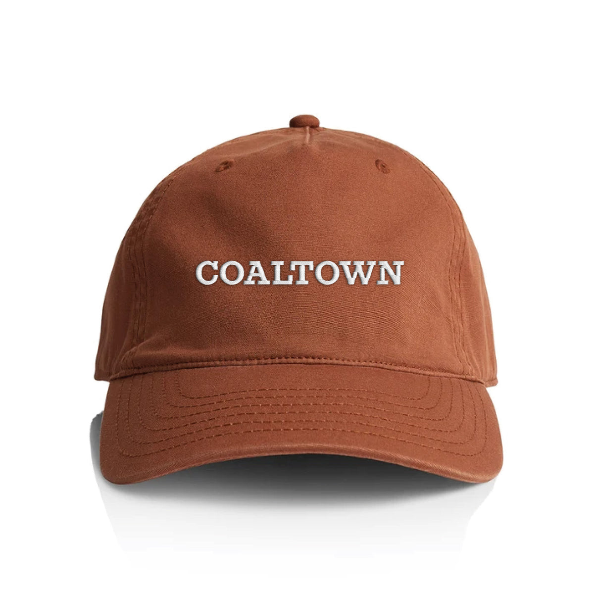 A terracotta cotton baseball cap with 'COALTOWN' embroidered in white capital letters on the front, shown against a plain white background.