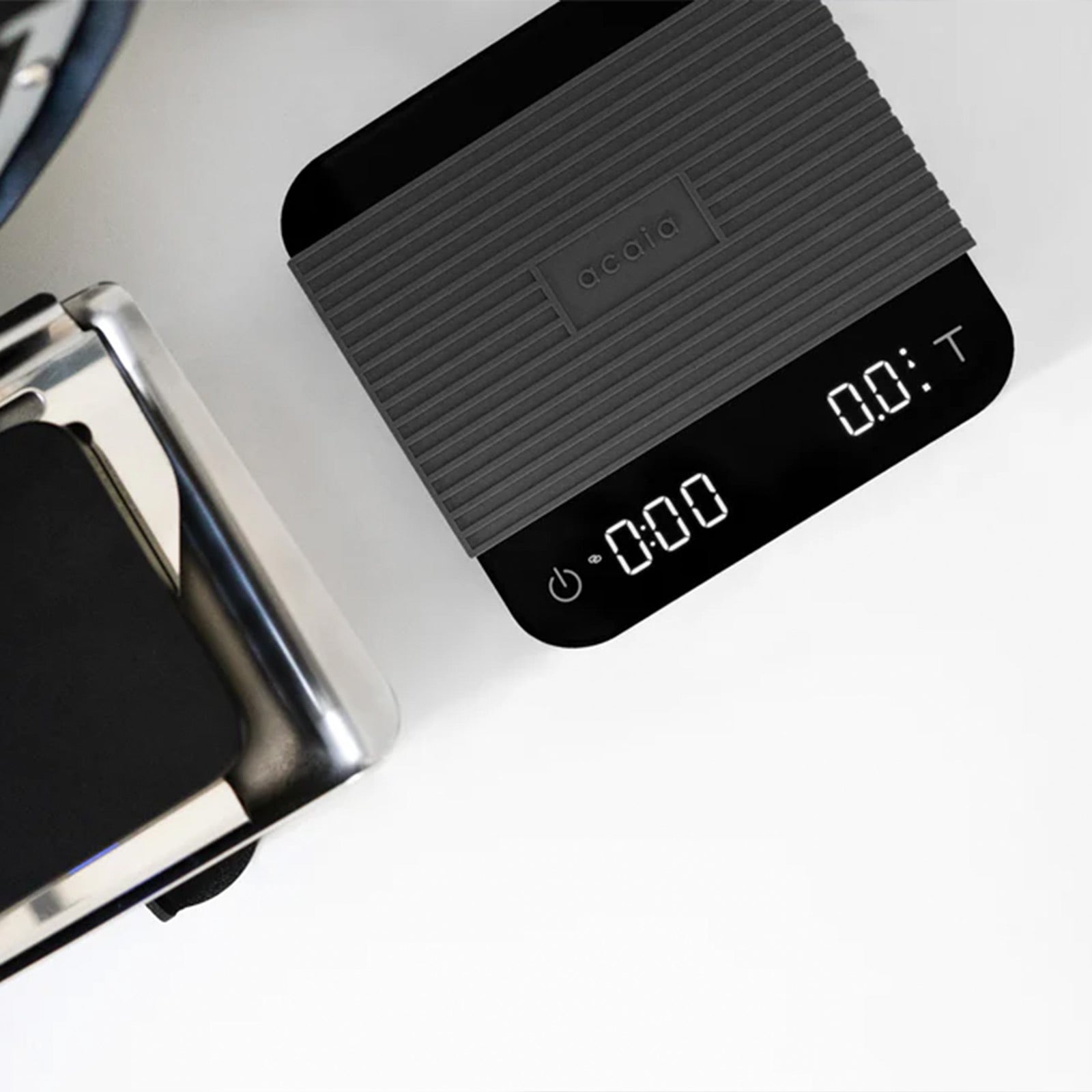 Acaia Lunar Umbra Scales Black Scales on a white counter 