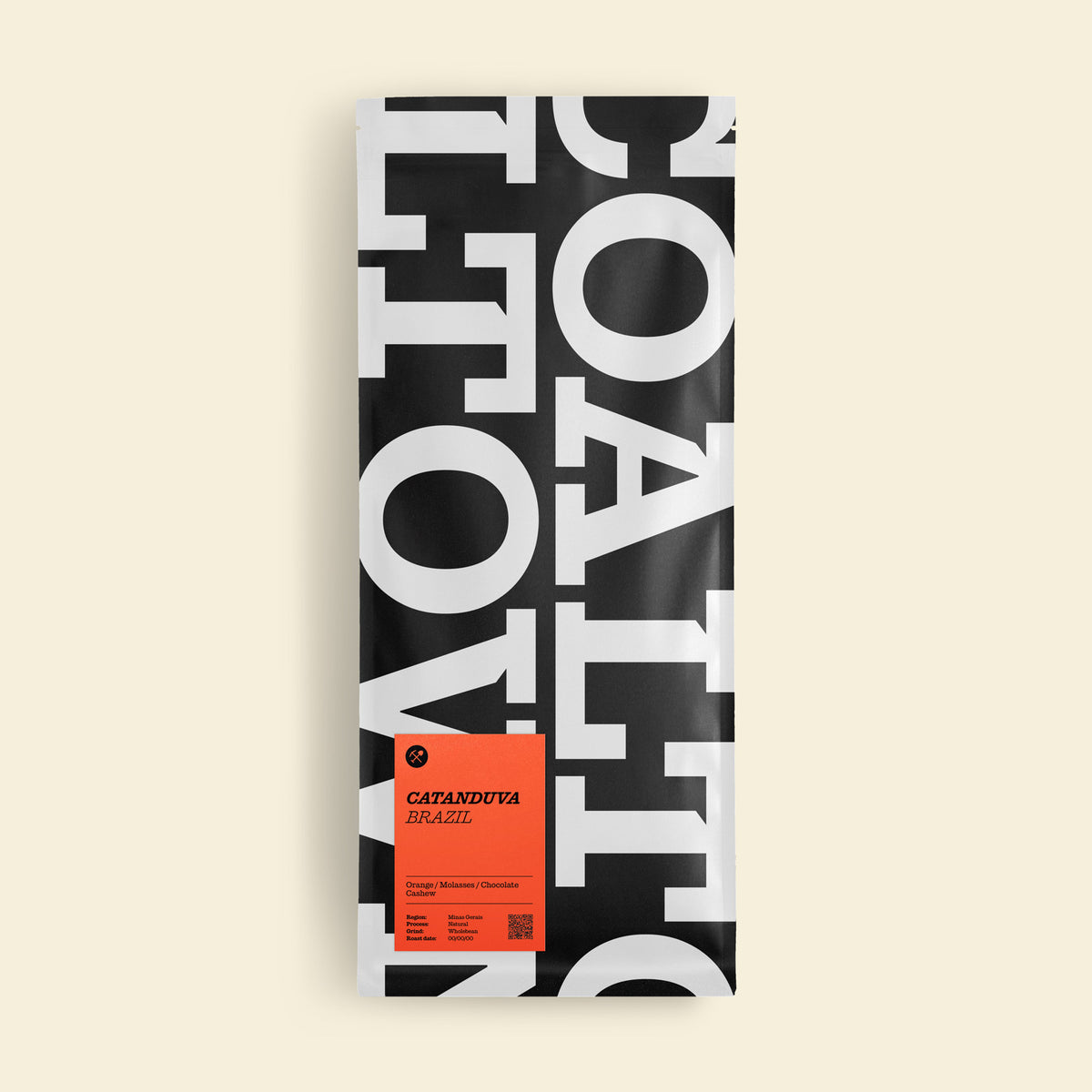 A tall rectangular package of coffee beans on a light cream background. The package is black and white with large overlapping typography and features a bright orange label near the bottom reading 'GATSANDUTA KILTZEL'.