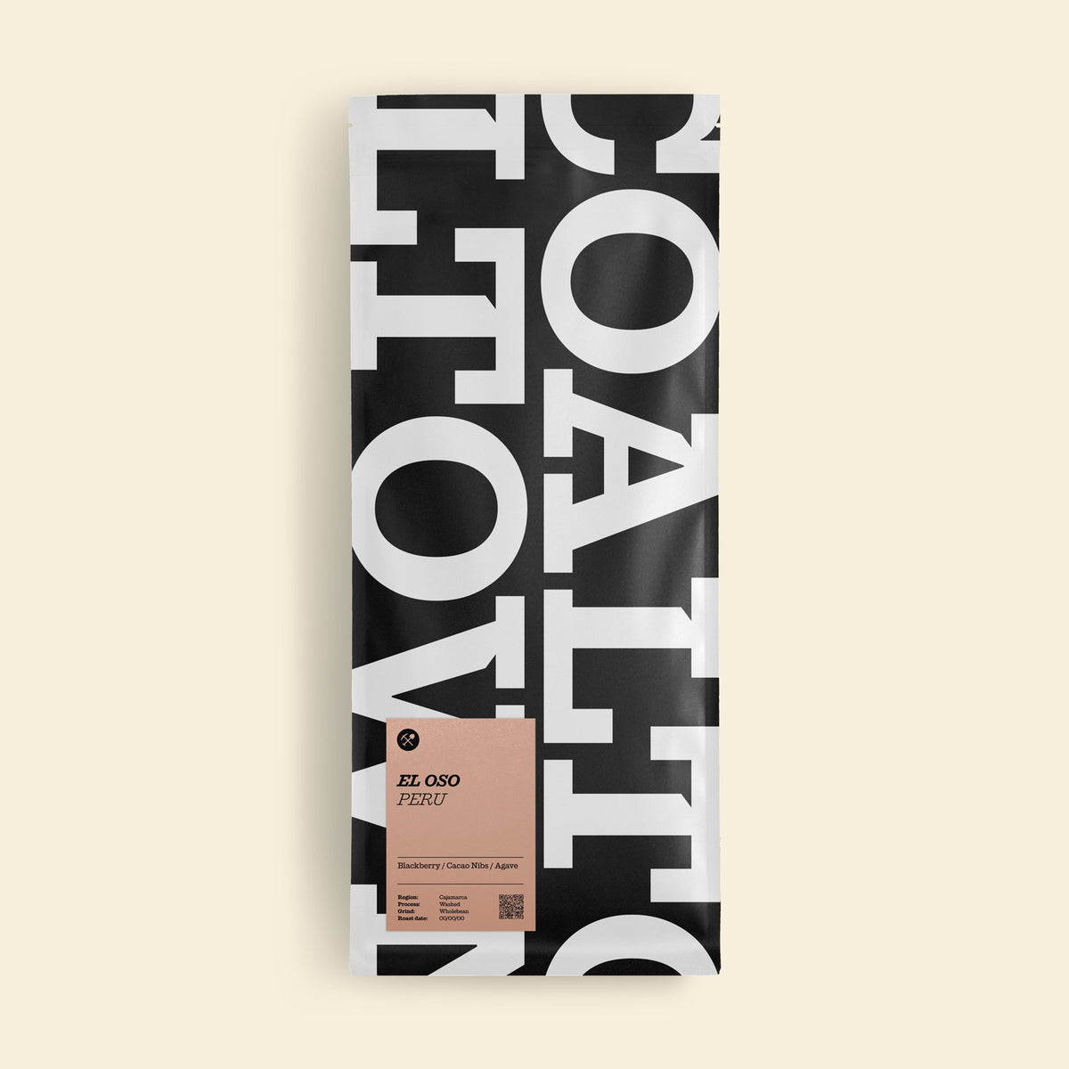 A tall rectangular package of El Oro Peruvian coffee, featuring a bold black and white typographic design with a dusty pink label near the bottom, set against a solid cream background.